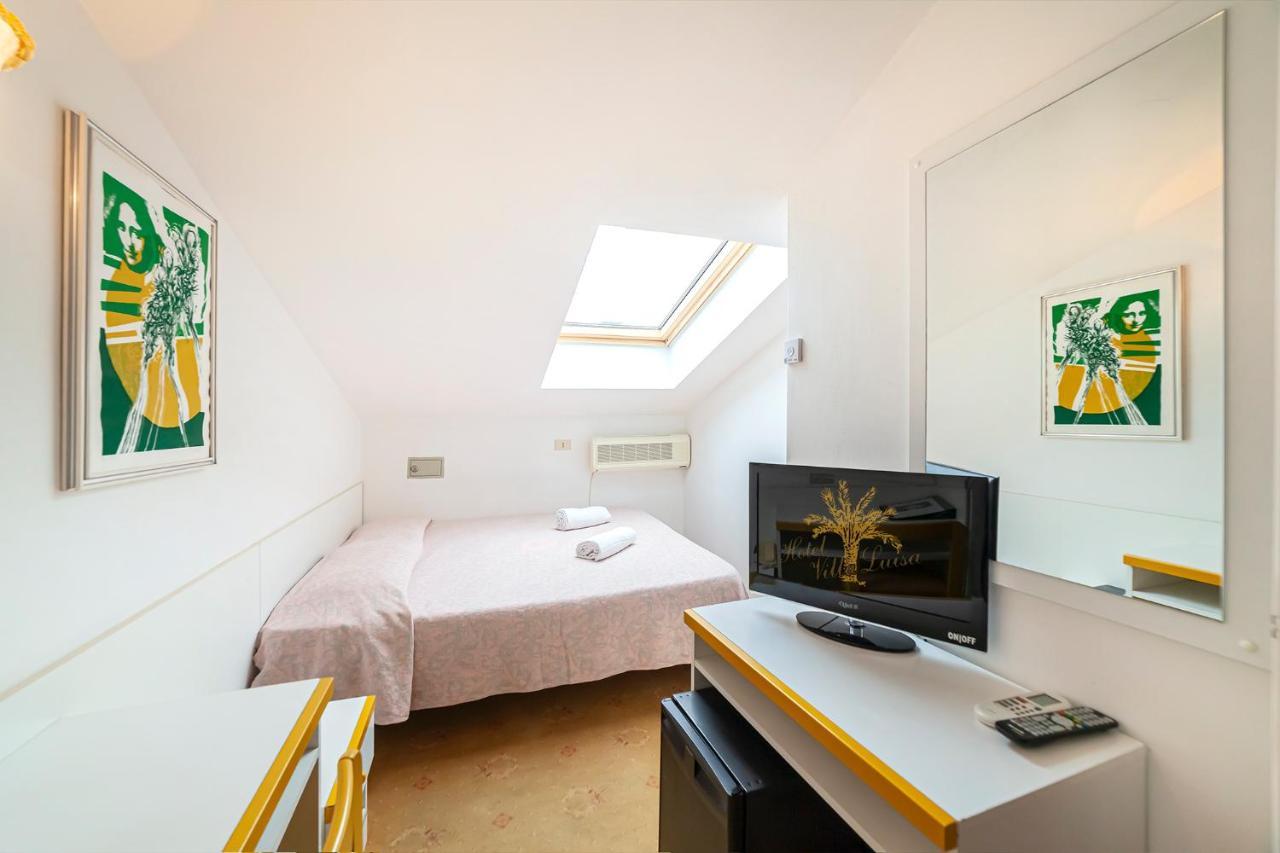 Hotel Villa Luisa Lignano Sabbiadoro Buitenkant foto
